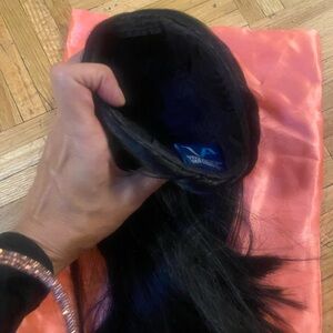 Sleek Black pony Hair Extension bun.